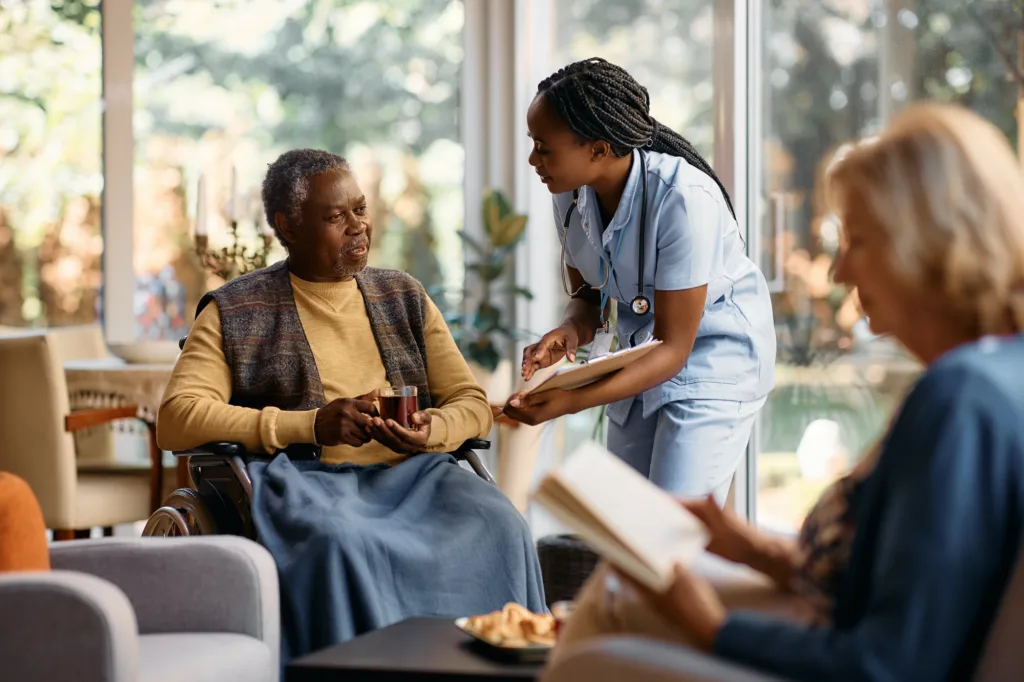 A nurse is talking to an older woman.